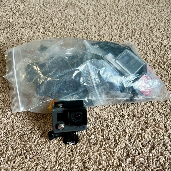 Go Pro with bag of unopened accessories. - Picture 3 of 5